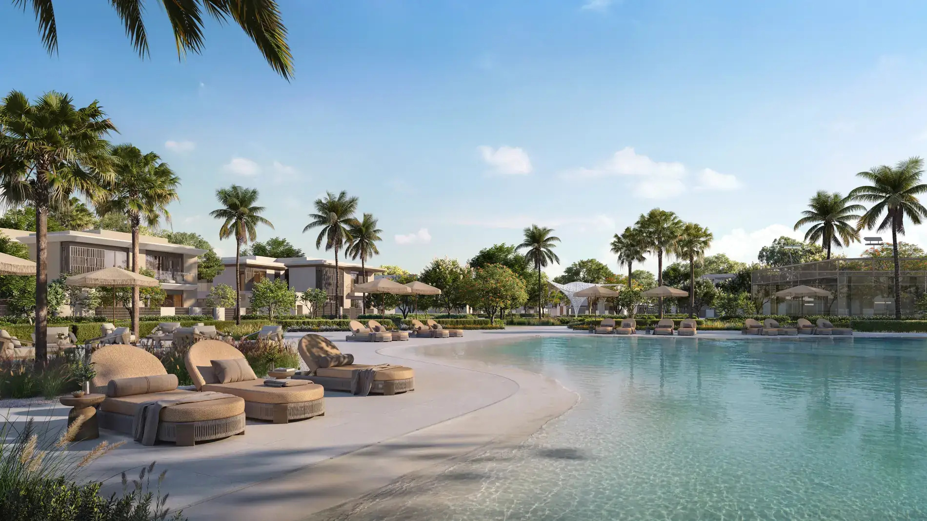 Talay Marsa Al Saadiyat — lagoon with a sandy beach and loungers inside the community, palms, villas beyond