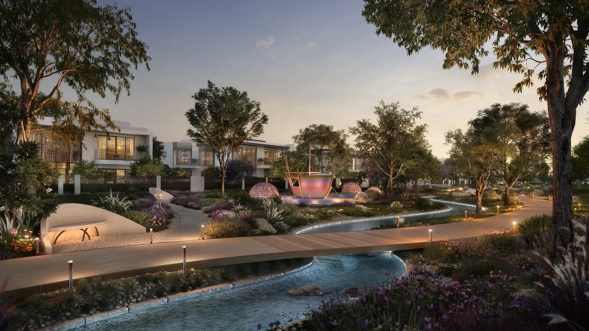 Talay Marsa Al Saadiyat — falaj-style water channel in the evening, lit pathways, playground shaped like a traditional dhow